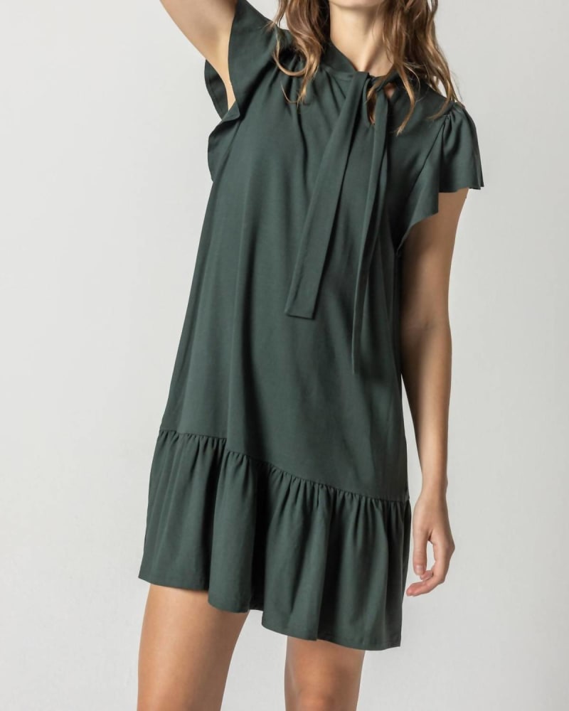 Front of a model wearing a size Large Tie Neck Peplum Dress In Loden in Loden by Lilla P. | dia_product_style_image_id:342393